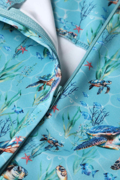 Close up view of Aquamarine Turtle Print Flared Dress