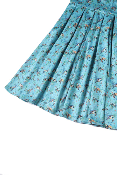 Close up view of Aquamarine Turtle Print Flared Dress