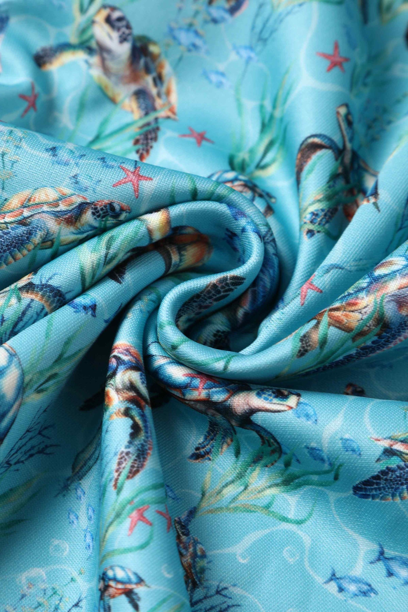Close up view of Aquamarine Turtle Print Flared Dress