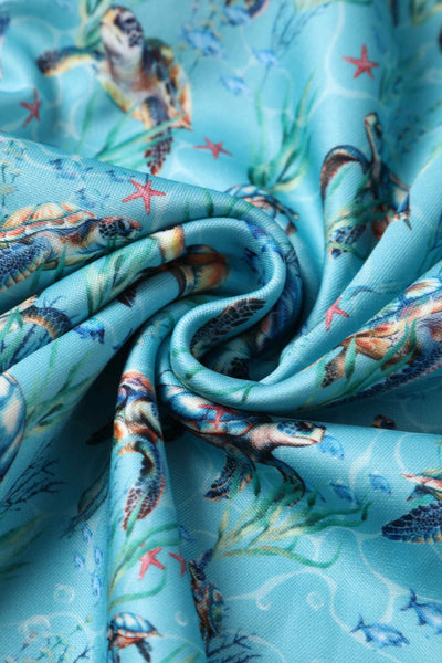 Close up view of Aquamarine Turtle Print Flared Dress