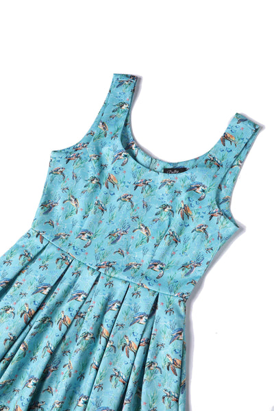 Close up view of Aquamarine Turtle Print Flared Dress