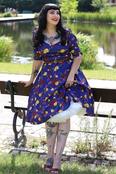 A model wearing a Scarlette Dark Blue Floral Midi Dress