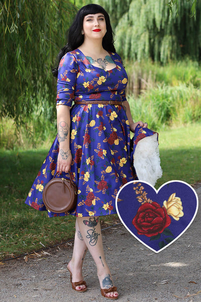 A lady wearing a Scarlette Dark Blue Floral Midi Dress