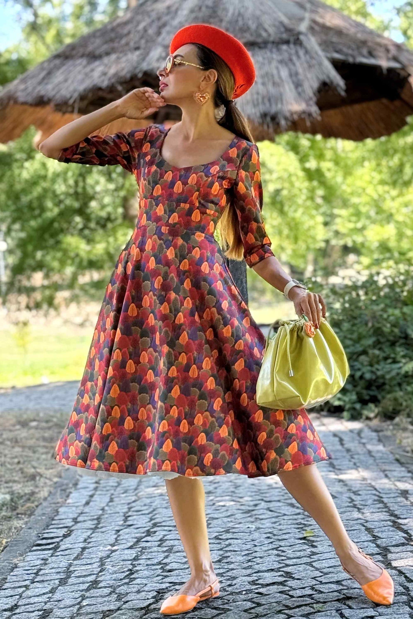 A model wearing a Scarlette Autumn Foliage Midi Dress