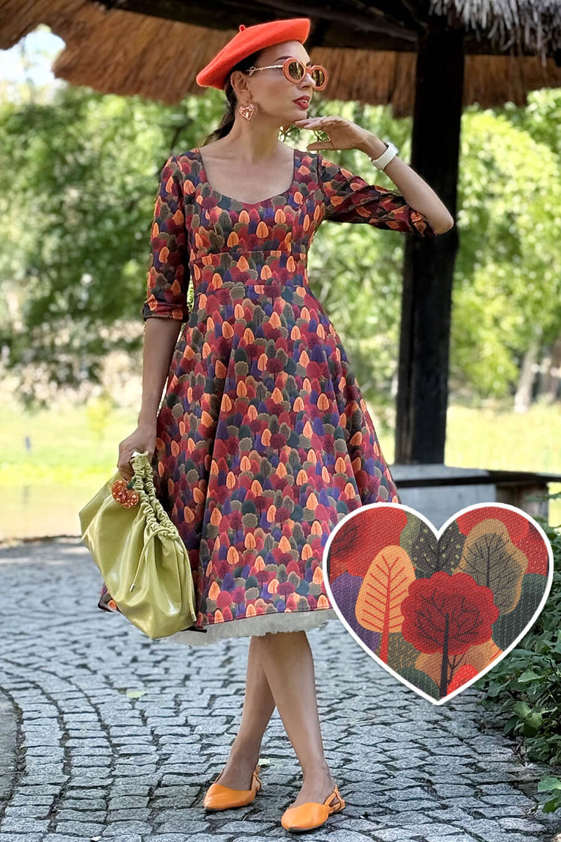 A model wearing a Scarlette Autumn Foliage Midi Dress