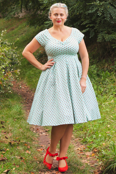 A model wearing a Baby Blue and Red Polka Dot Off Shoulder Dress
