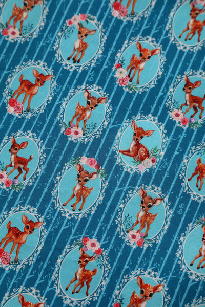 Close up view of Baby Deer Midi Shirt Dress In Blue