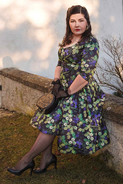 A lady wearing a Berry Print Dress