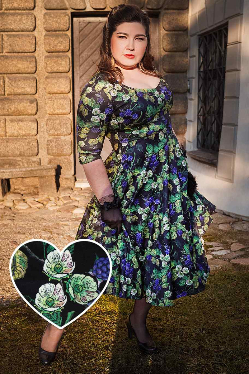 A lady wearing a Berry Print Dress
