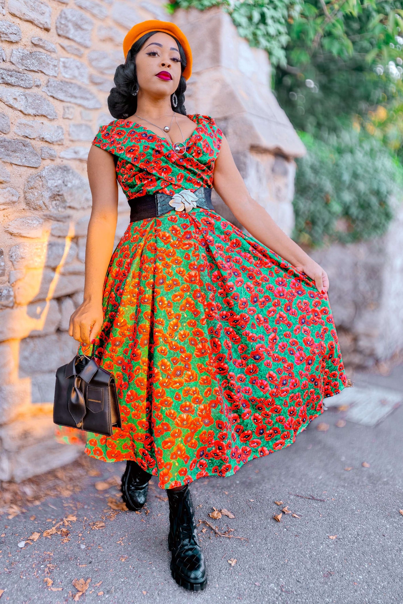 A woman wearing Beverly Red Poppy Garden Off Shoulder Dress