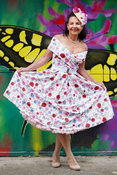 A lovely model wearing a Beverly Rose Off Shoulder Dress In White