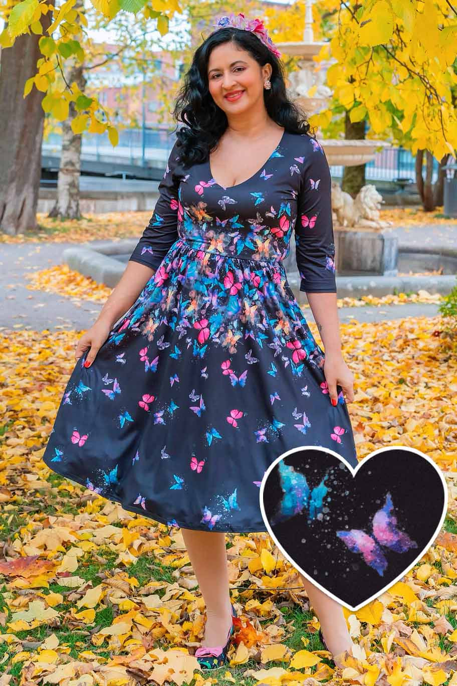 Model wearing a Billie Black Butterfly Long Sleeved Dress