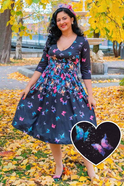 Model wearing a Billie Black Butterfly Long Sleeved Dress