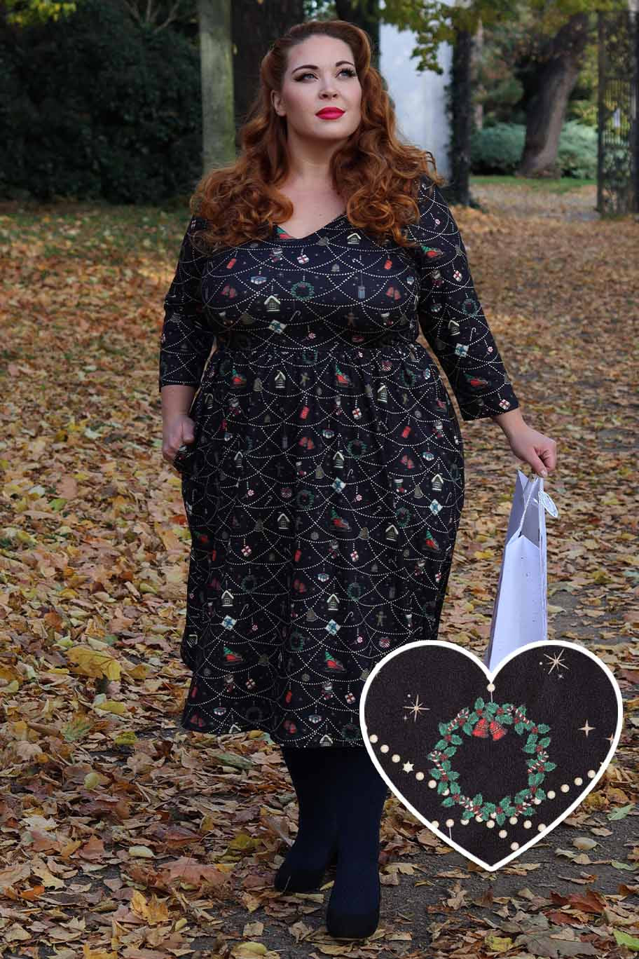 A model wearing a Billie Christmas Print Long Sleeved Dress