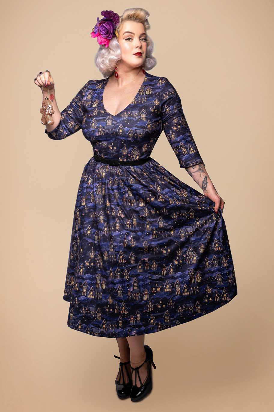 A lady wearing a Billie Purple Christmas Eve Flared Dress