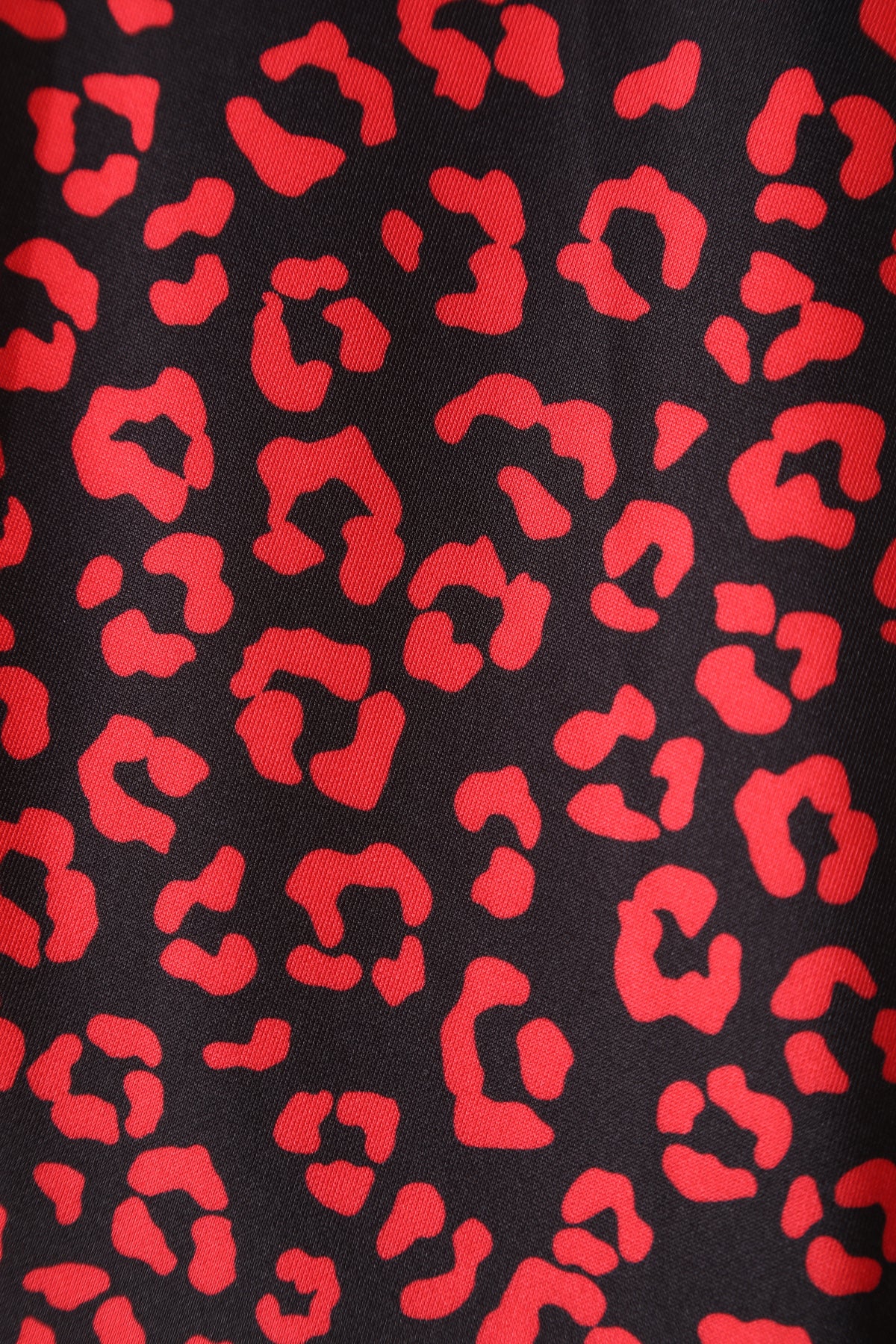 Close up view of Black & Red Cheetah Print Off Shoulder Dress