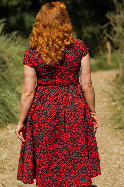 A model wearing a Black & Red Cheetah Print Off Shoulder Dress