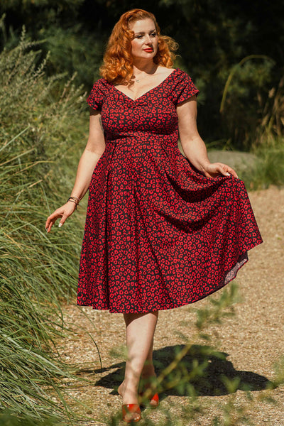 A model wearing a Black & Red Cheetah Print Off Shoulder Dress