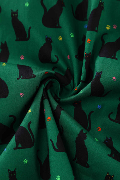 Close up view of Black Cat Midi Shirt Dress In Green
