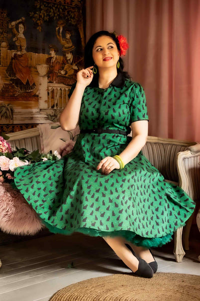 A model wearing Black Cat Midi Shirt Dress In Green