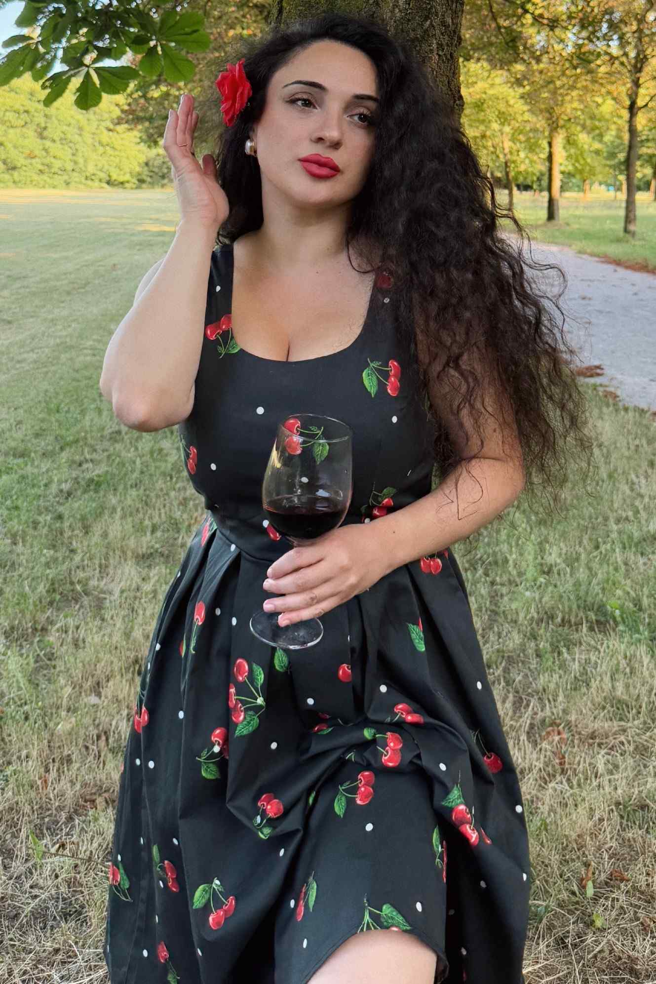 A model wearing a Black Cherry Retro Flared Dress In Cotton