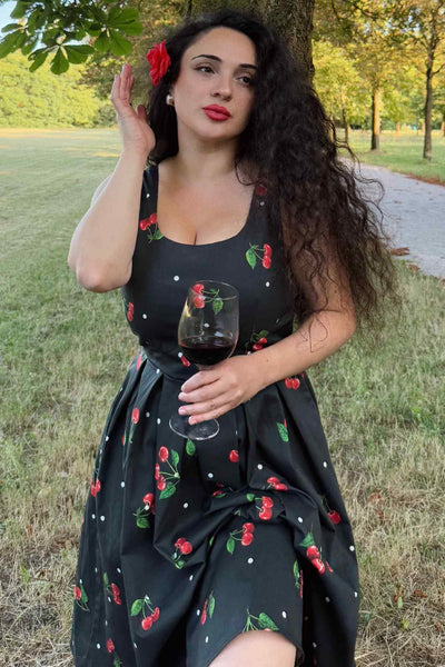 A model wearing a Black Cherry Retro Flared Dress In Cotton