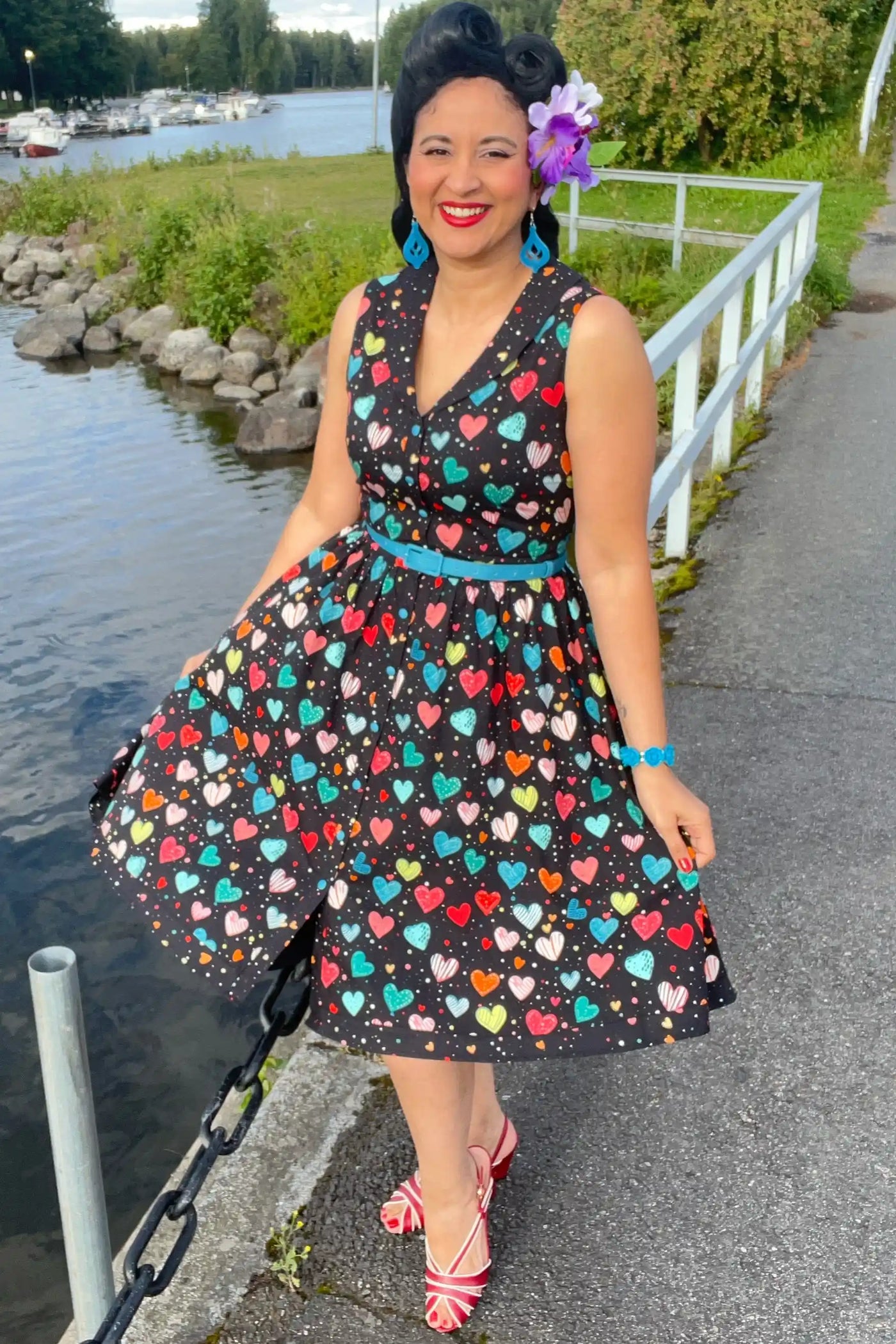 A lady wearing a Black Colourful Heart Shirt Dress
