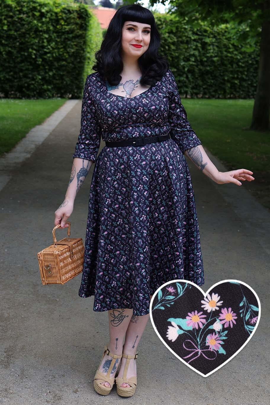 A model wearing Black Floral Grid Midi Dress