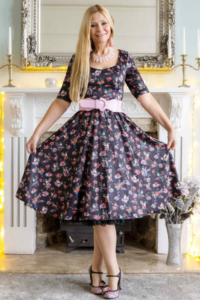 A model wearing Black Hummingbird Midi Dress