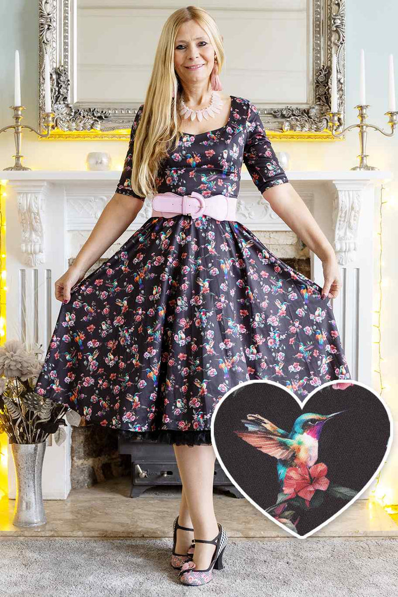 A model wearing a Black Hummingbird Midi Dress