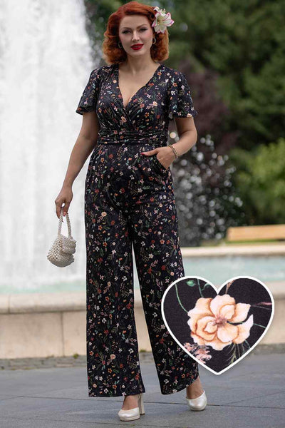 A model wearing Black Meadow Butterfly Sleeved Jumpsuit