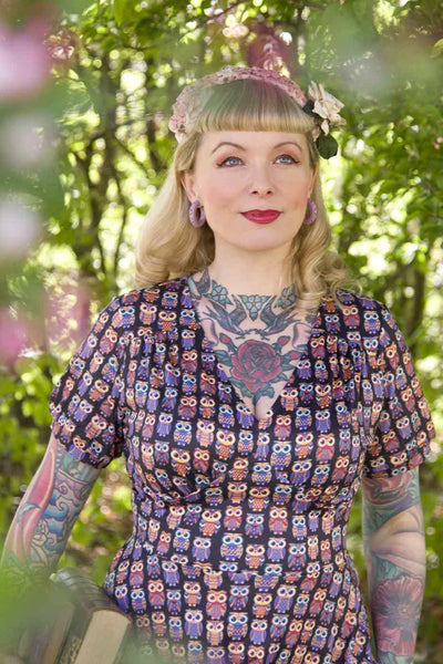 A model wearing Black Midi Dress in Aztec Owl Print