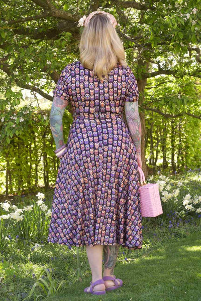 A model wearing Black Midi Dress in Aztec Owl Print