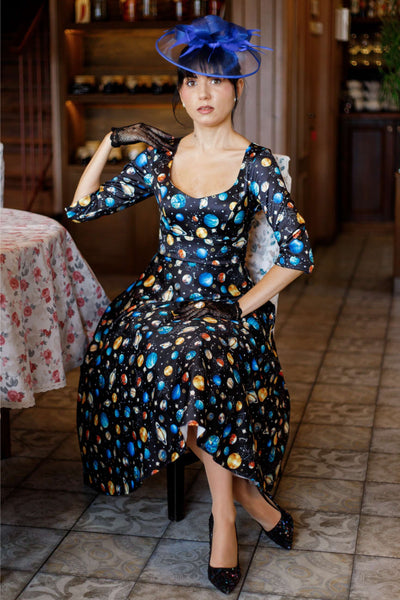 A woman wearing a Scarlette Black Planet Dress