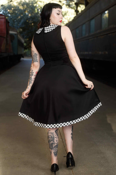 Back view of model wearing Black Sleeveless Shirt Dress With Gingham Stripes