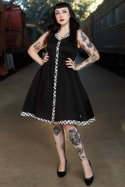 Front view of model wearing Black Sleeveless Shirt Dress With Gingham Stripes