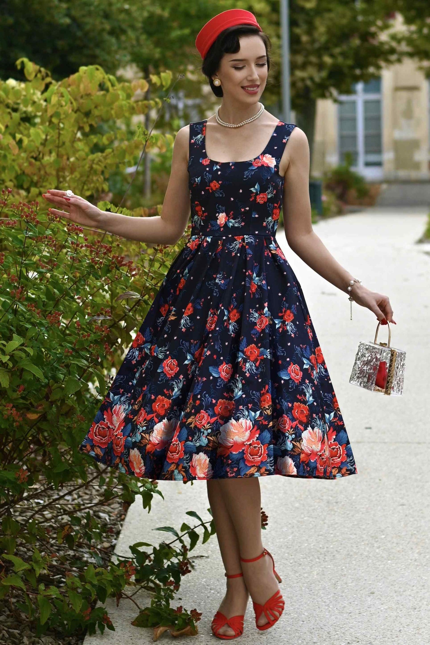 A lady wearing an Amanda Black Tapestry Floral Swing Dress