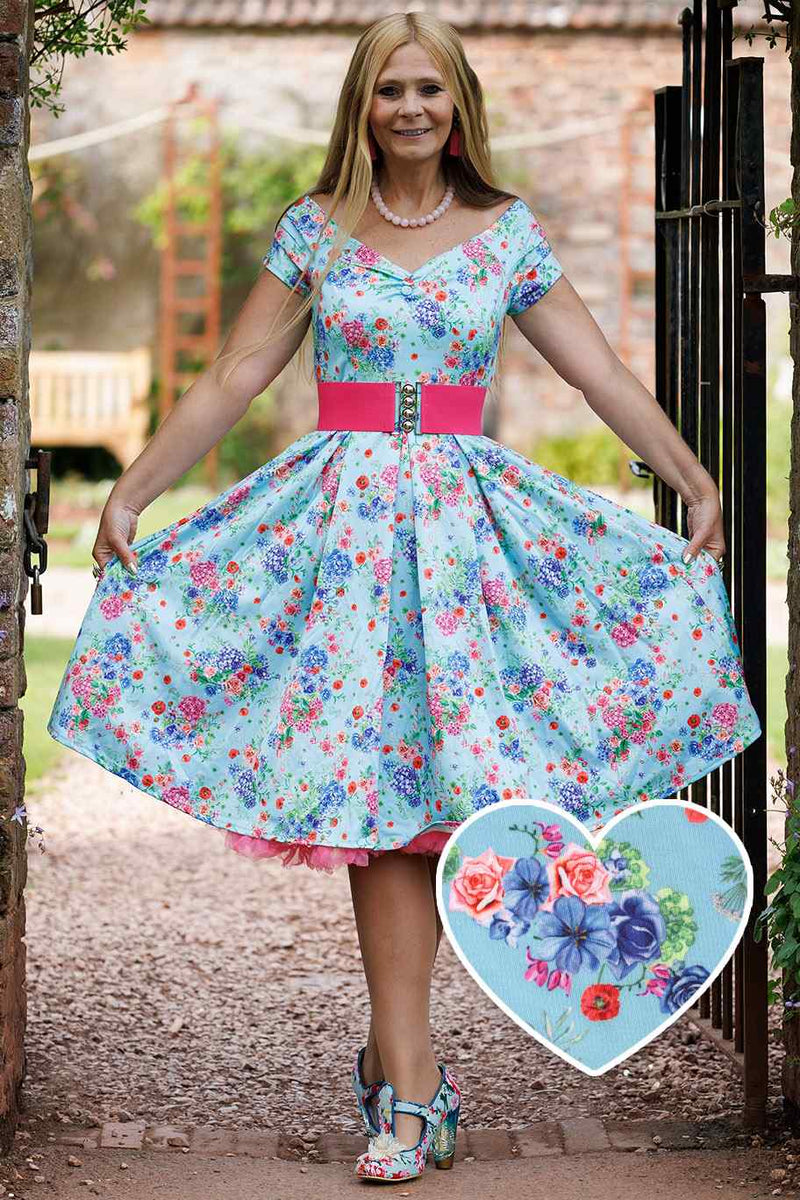 A model wearing a Blue Hydrangea Off Shoulder Dress