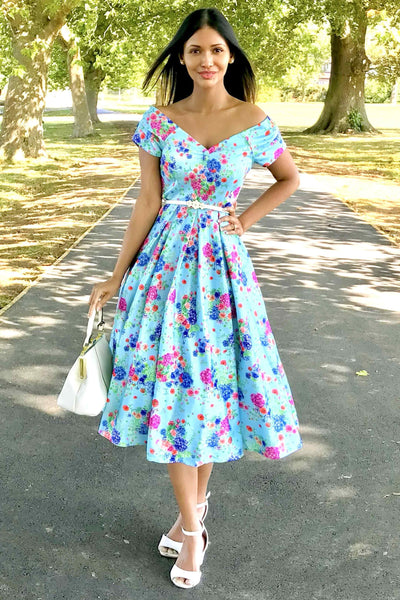 A model wearing Blue Hydrangea Off Shoulder Dress In Cotton