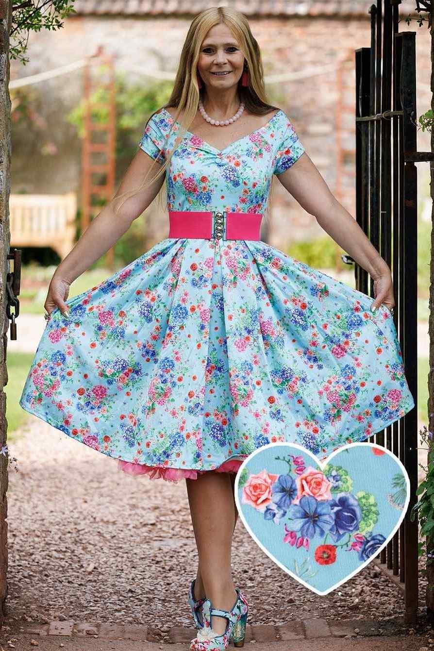A model wearing Blue Hydrangea Off Shoulder Dress In Cotton