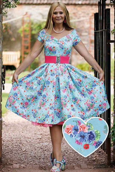 A model wearing Blue Hydrangea Off Shoulder Dress In Cotton