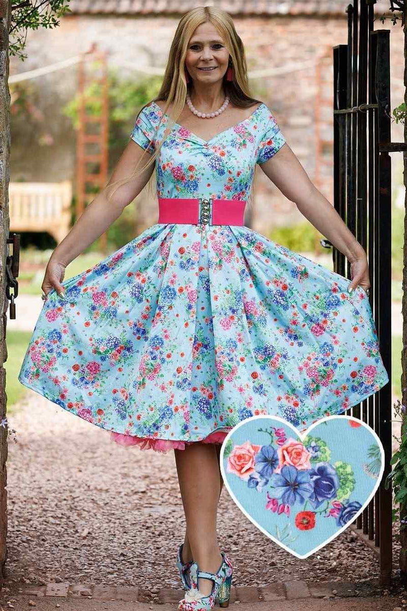 A model wearing Blue Hydrangea Off Shoulder Dress In Cotton
