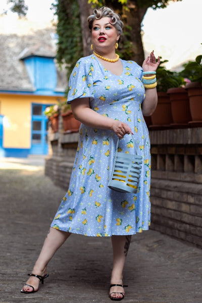 A lady wearing a Blue Lemon Petal Sleeved Tea Dress
