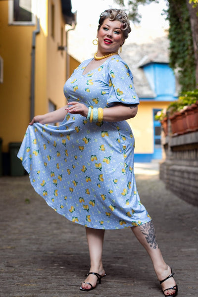 A lady wearing a Blue Lemon Petal Sleeved Tea Dress
