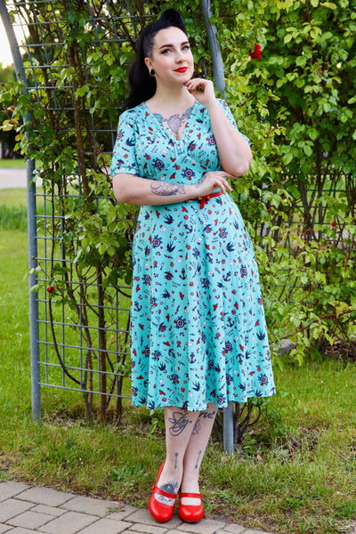 A woman wearing Blue Nautical Tattoo Midi Dress