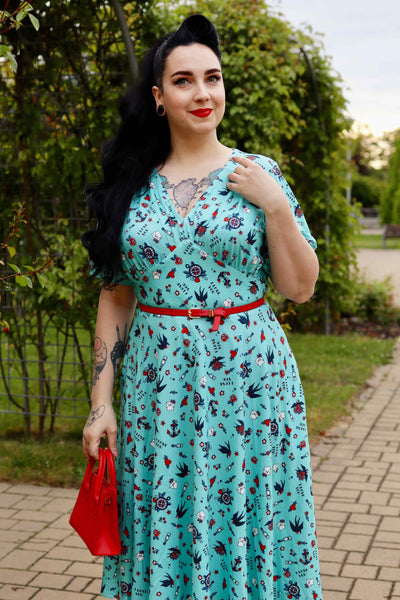 A model wearing Blue Nautical Tattoo Midi Dress