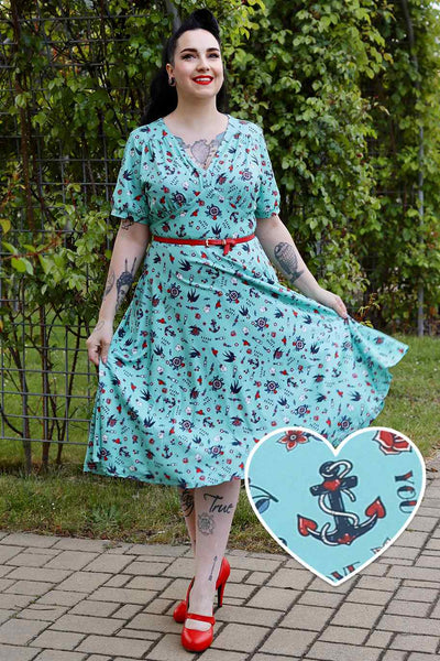 A lady wearing Blue Nautical Tattoo Midi Dress