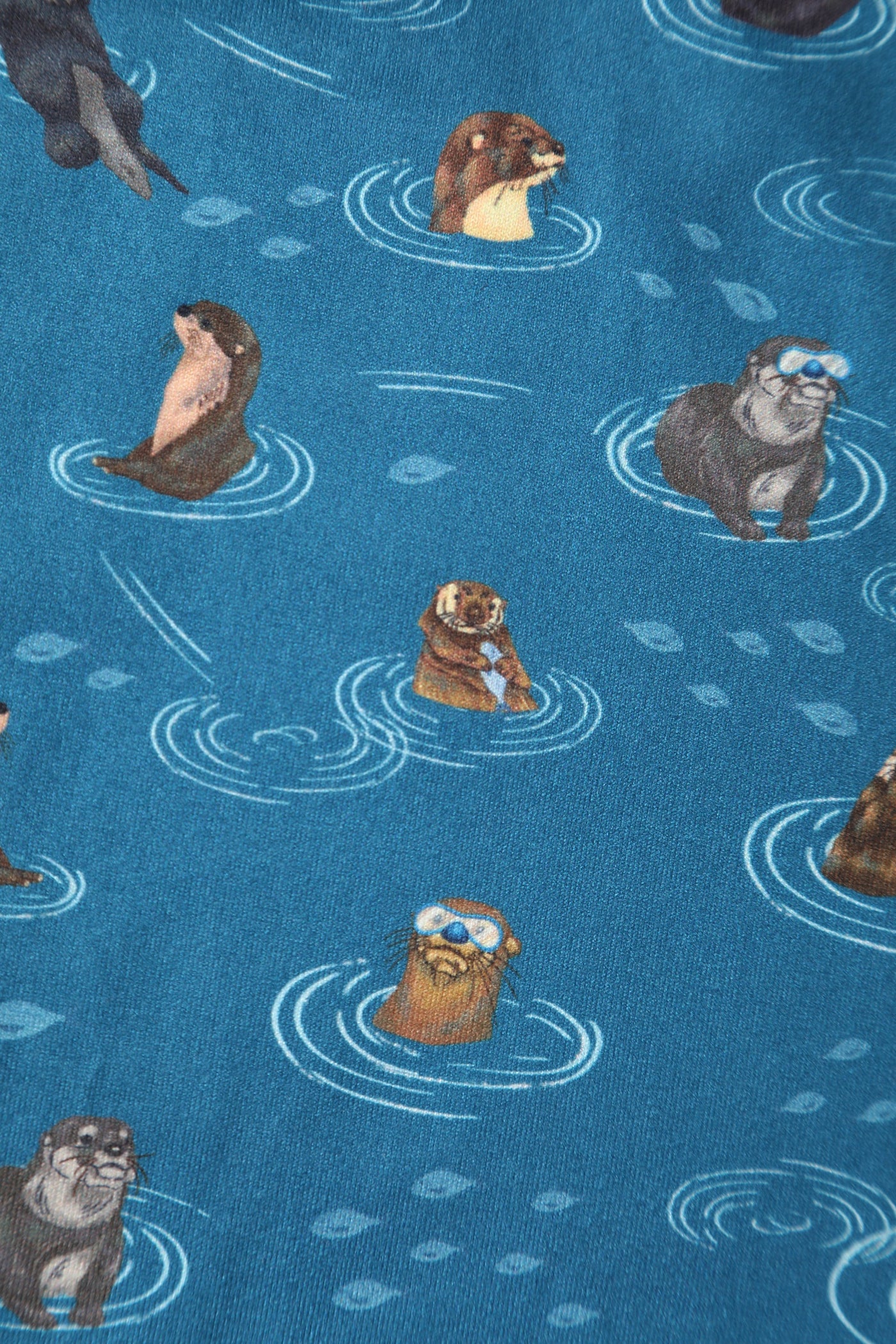   blue otter family print on knit fabric