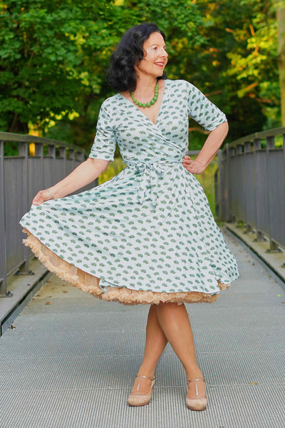 front view of A model wearing Blue Sea Turtle Wrap Dress
