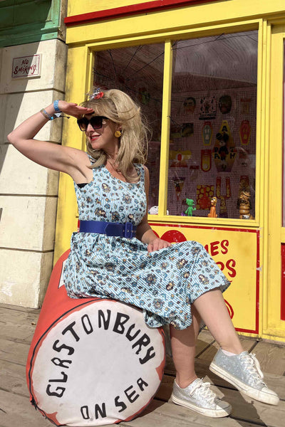 A lady wearing a Blue Striped Flared Dress in Nautical Print